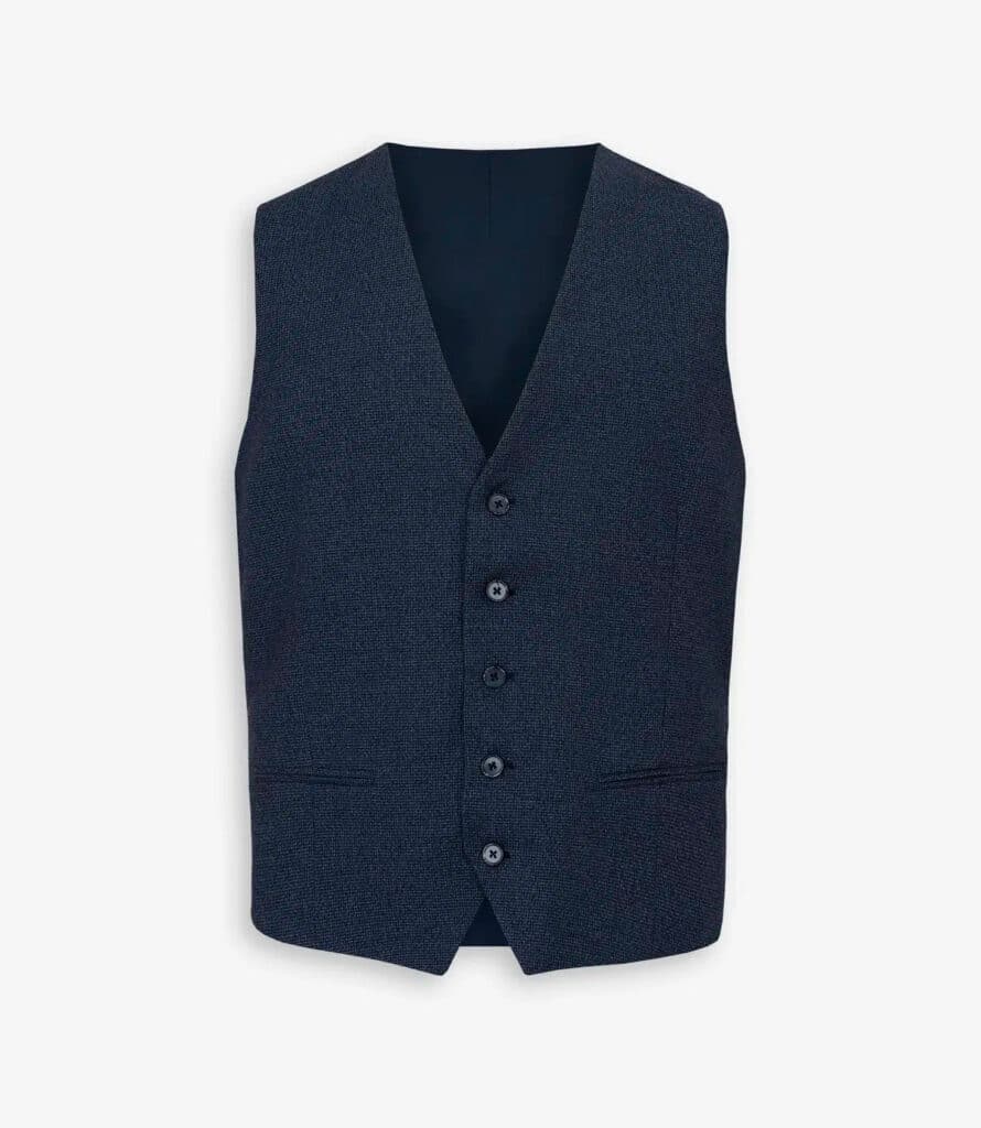 Moda, música y estilo: así celebró Dan John la Navidad en Serrano 9 Chaleco pata de gallo azul